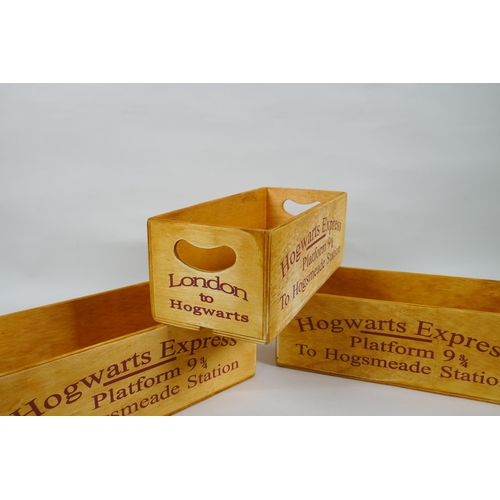 130 - A set of three Harry Potter 'Hogwarts Express' wooden condiment trays, 28 x 12cm