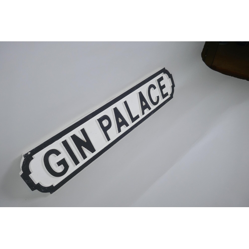 131 - A painted wood 'Gin Palace' road sign, 14 x 65cm long