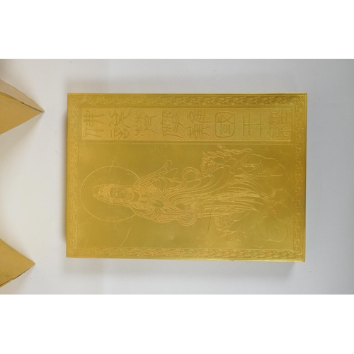 132 - A Chinese gilt metal box containing a metal leaved concertina book with repousse inscriptions, 15 x ... 