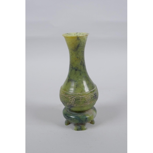 140 - A Chinese mottled green jade stem vase, 13cm high