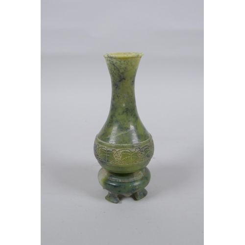 140 - A Chinese mottled green jade stem vase, 13cm high