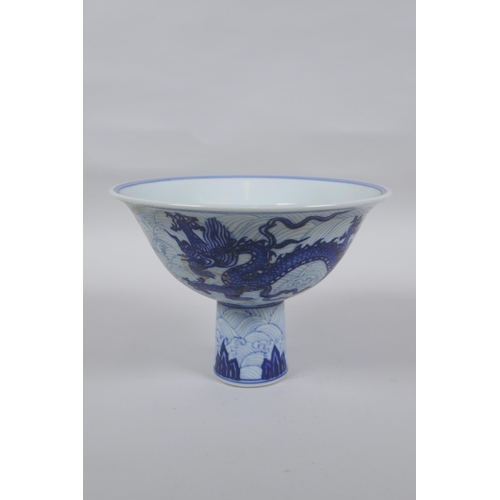 141 - A blue and white porcelain stem bowl decorated with twin dragons, Chinese Xuande 6 character mark to... 