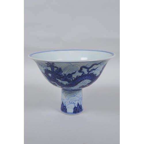 141 - A blue and white porcelain stem bowl decorated with twin dragons, Chinese Xuande 6 character mark to... 