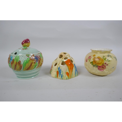 145 - A Clarice Cliff Bizarre Crocus pattern flower frog, a Clarice Cliff for Newport Pottery sugar pot, a... 