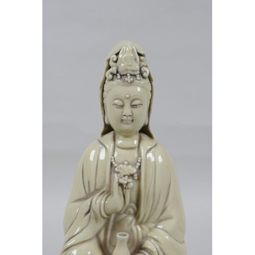 148 - A Chinese blanc de chine porcelain Quan Yin, impressed marks verso, 26cm high