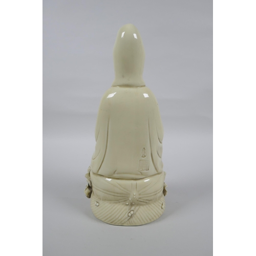 148 - A Chinese blanc de chine porcelain Quan Yin, impressed marks verso, 26cm high