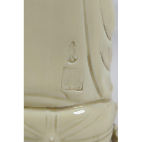 148 - A Chinese blanc de chine porcelain Quan Yin, impressed marks verso, 26cm high