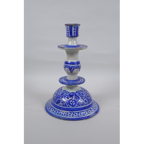 150 - A blue and white tin glazed ceramic hookah base/candlestick, 25cm high