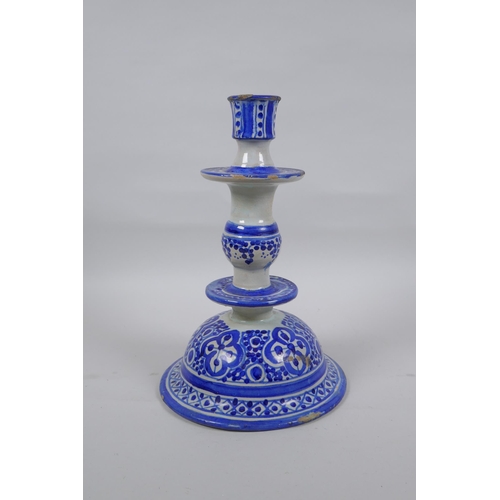 150 - A blue and white tin glazed ceramic hookah base/candlestick, 25cm high