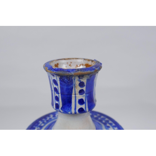 150 - A blue and white tin glazed ceramic hookah base/candlestick, 25cm high