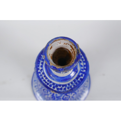 150 - A blue and white tin glazed ceramic hookah base/candlestick, 25cm high