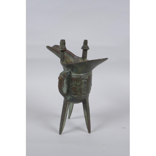 151 - A Chinese archaic style bronze jue, 18cm high