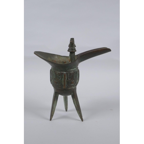 151 - A Chinese archaic style bronze jue, 18cm high