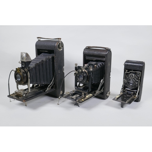 156 - Three early C20th medium and large format cameras including a Kodak No.3A Autographic, a Houghton En... 