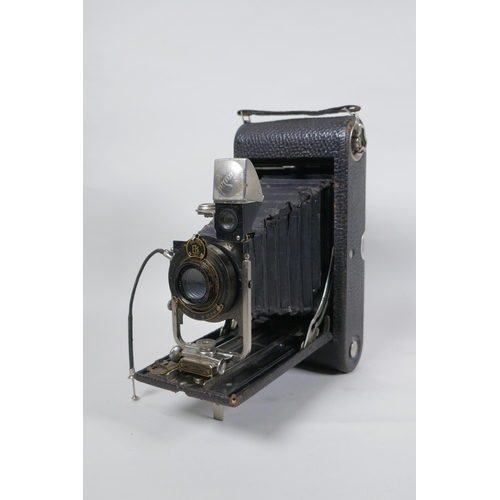 156 - Three early C20th medium and large format cameras including a Kodak No.3A Autographic, a Houghton En... 