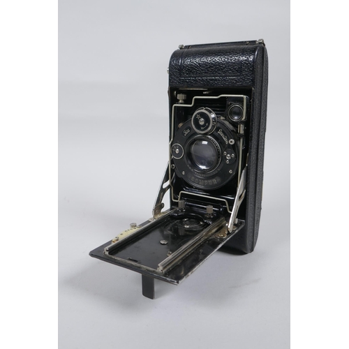 156 - Three early C20th medium and large format cameras including a Kodak No.3A Autographic, a Houghton En... 