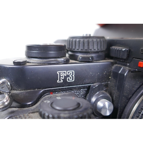 157 - A Nikon F3 SLR camera, Serial No 1265547, fitted with a Zoom Nikkor 25-50mm F:4 lens and a Nikon MD-... 