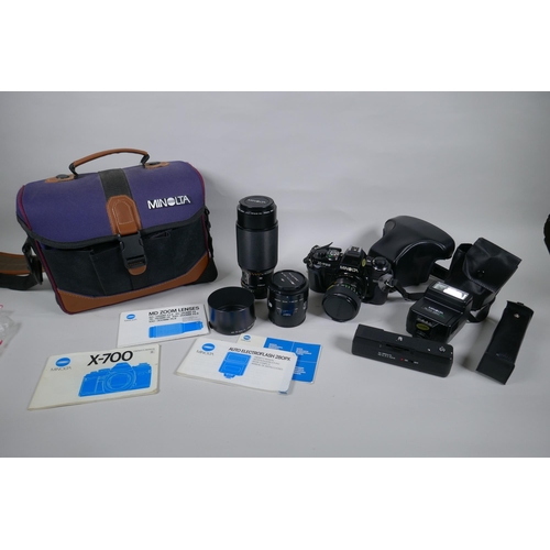 159 - A Minolta X-700 SLR camera fitted with a Soligor zoom and macro 28-55mm lens, and a collection of ac... 