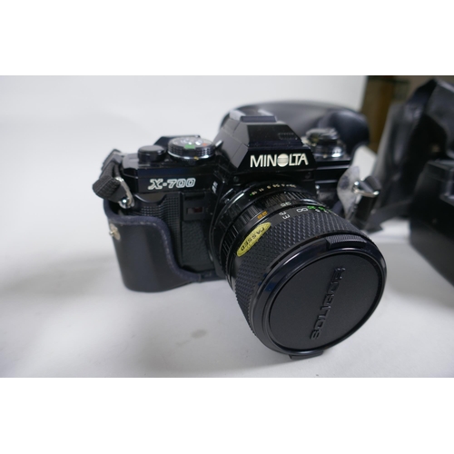 159 - A Minolta X-700 SLR camera fitted with a Soligor zoom and macro 28-55mm lens, and a collection of ac... 