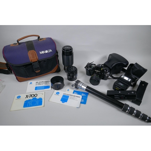 159 - A Minolta X-700 SLR camera fitted with a Soligor zoom and macro 28-55mm lens, and a collection of ac... 