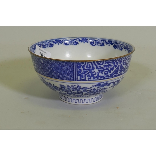 162 - An oriental bowl with blue and white transfer decoration, 15cm diameter