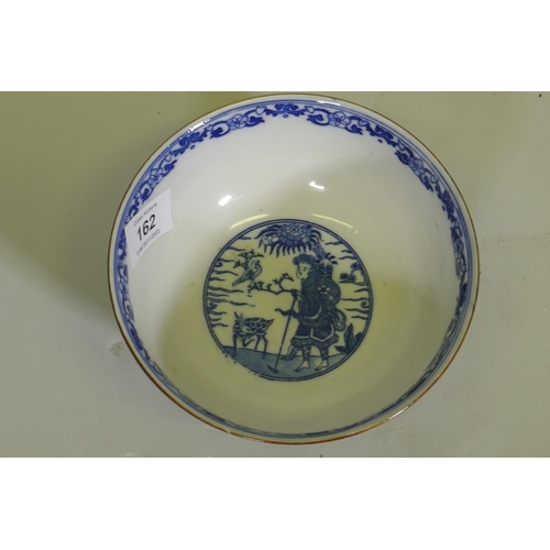 162 - An oriental bowl with blue and white transfer decoration, 15cm diameter