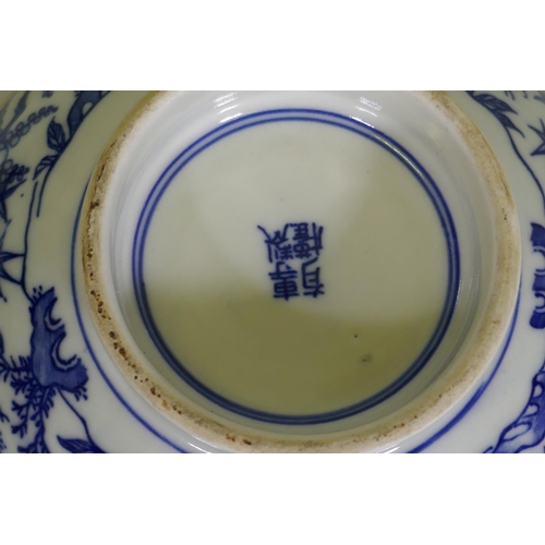 162 - An oriental bowl with blue and white transfer decoration, 15cm diameter