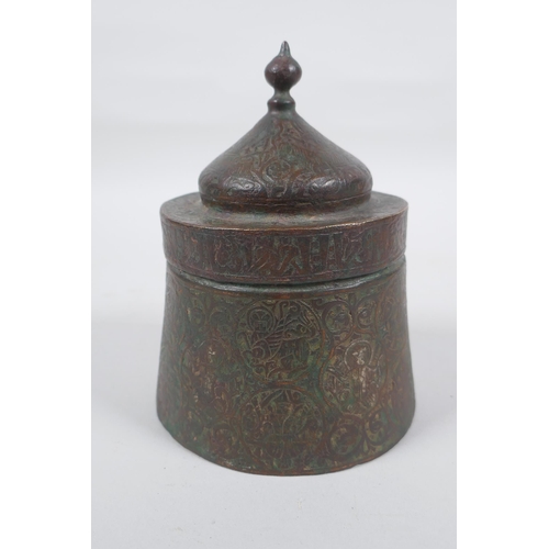 163 - An antique Persian copper ink well with remnants of multi metal inlaid decoration, possibly Khorassa... 