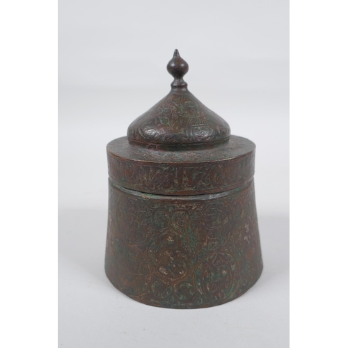 163 - An antique Persian copper ink well with remnants of multi metal inlaid decoration, possibly Khorassa... 