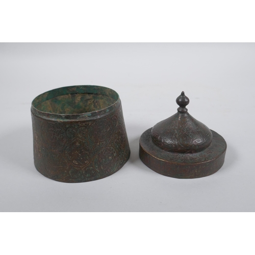 163 - An antique Persian copper ink well with remnants of multi metal inlaid decoration, possibly Khorassa... 