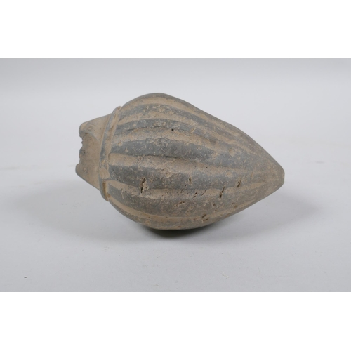 165 - An early ceramic hand grenade/bomb, possibly C12th/C13th, with ribbed body and impressed motifs, 13c... 