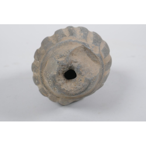 165 - An early ceramic hand grenade/bomb, possibly C12th/C13th, with ribbed body and impressed motifs, 13c... 