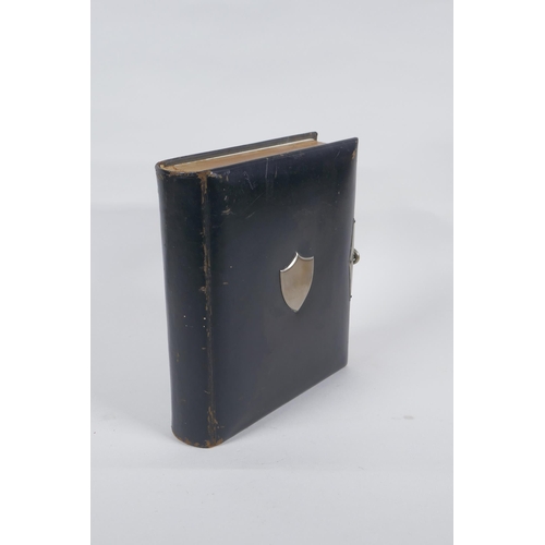 167 - A Victorian tooled leather photograph album with silver plated mounts, 17 x 20cm