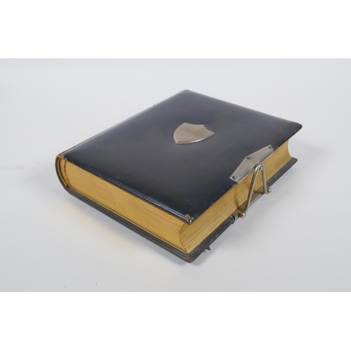 167 - A Victorian tooled leather photograph album with silver plated mounts, 17 x 20cm