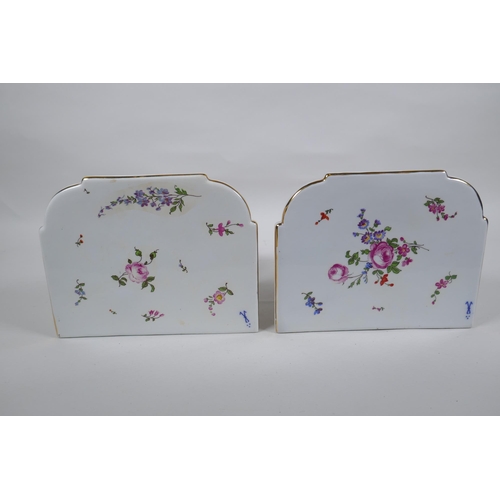 168 - A pair of Dresden style porcelain wall shelves decorated with putti and flowers, 24cm high