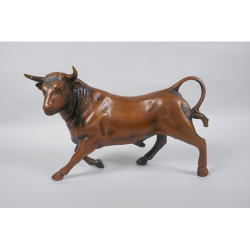 170 - A filled coppered metal bull, 30cm long