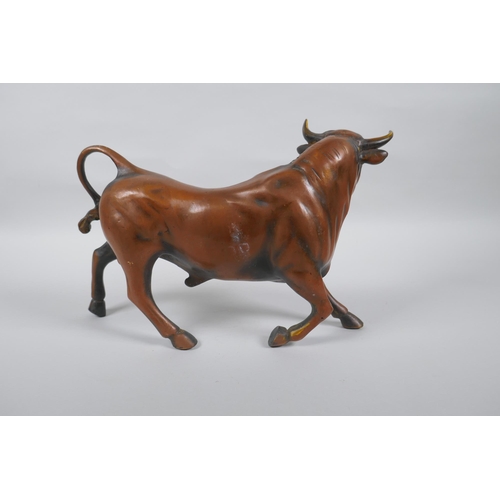 170 - A filled coppered metal bull, 30cm long