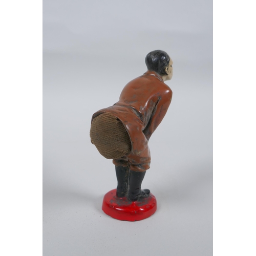 171 - A cold painted metal figural pin cushion, 12cm high