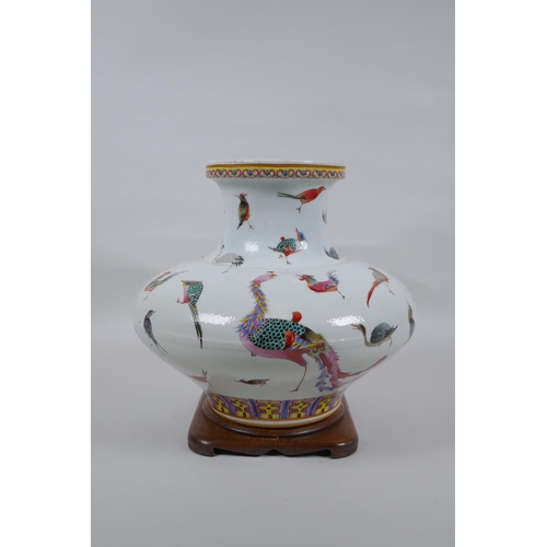 18 - A Chinese late C19th polychrome porcelain squat form vase with allover enamelled bird decoration, Gu... 