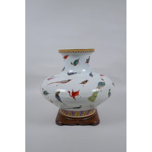 18 - A Chinese late C19th polychrome porcelain squat form vase with allover enamelled bird decoration, Gu... 