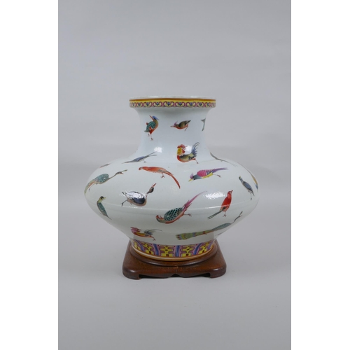 18 - A Chinese late C19th polychrome porcelain squat form vase with allover enamelled bird decoration, Gu... 