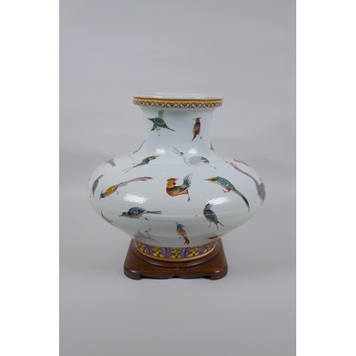 18 - A Chinese late C19th polychrome porcelain squat form vase with allover enamelled bird decoration, Gu... 