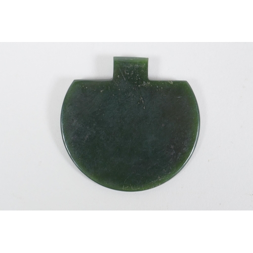 197 - An Eastern spinach jade pendant with chased Islamic script decoration, and another decorated with a ... 