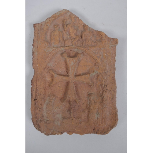 202 - An antique terracotta panel with raised decoration of a coptic cross and figure, 10 x 16cm