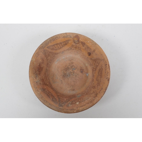 205 - A Moorish terracotta bowl, 9.5cm diameter