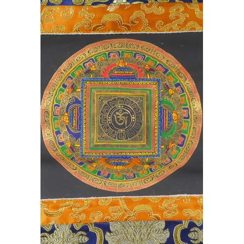 207 - A hand painted Tibetan Mandala, in hanging silk mount, 48 x 58cm