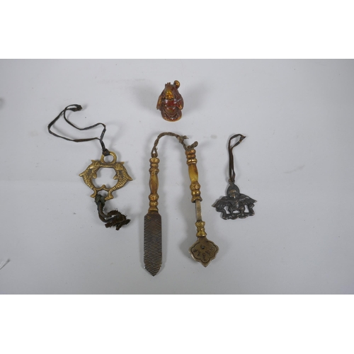 208 - Two Tibetan brass medical instruments/tools, together with a Sino Tibetan bronze Buddha and two bras... 