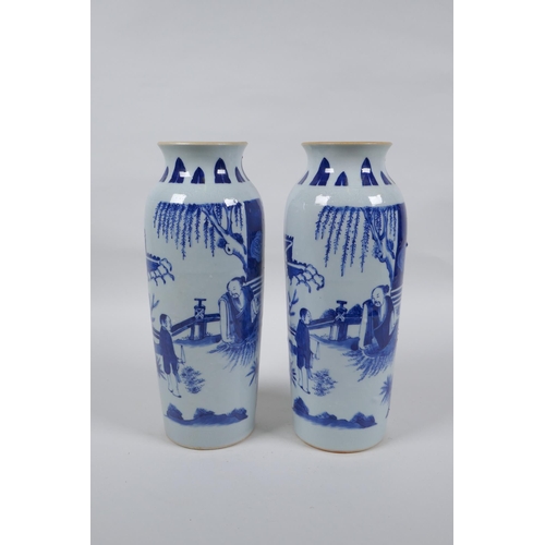 223 - A pair of Chinese blue and white porcelain vases decorated with figures in a garden, 23cm high