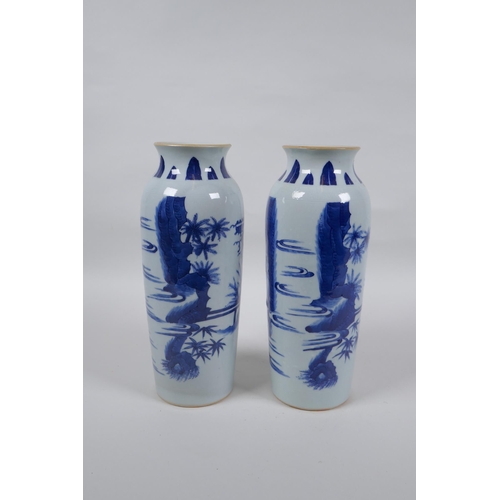 223 - A pair of Chinese blue and white porcelain vases decorated with figures in a garden, 23cm high