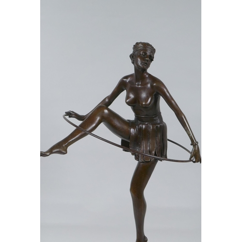 226 - After Dominque  Alonzo, Art Deco style bronze of a dancing girl with a hula hoop, on a marble s... 